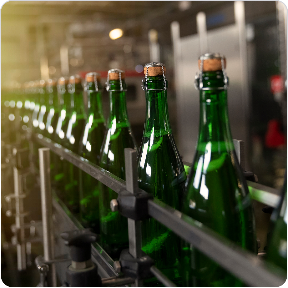 Alcohol bottles on a production line representing beverage logistics
