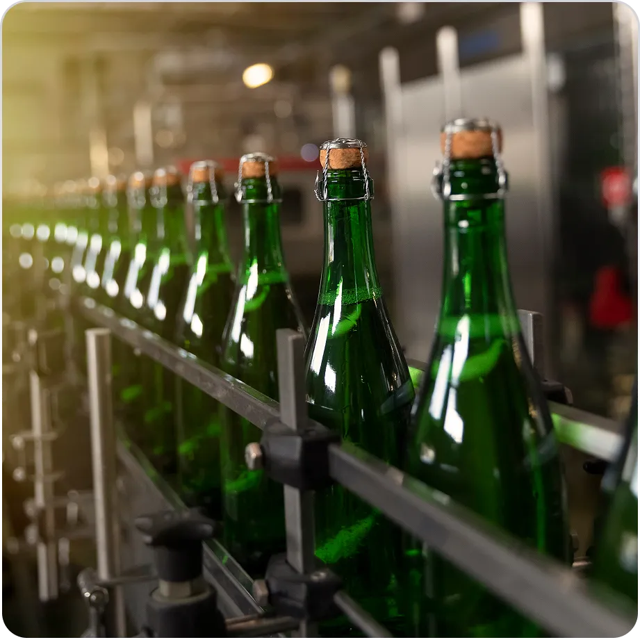 Alcohol bottles on a production line representing beverage logistics
